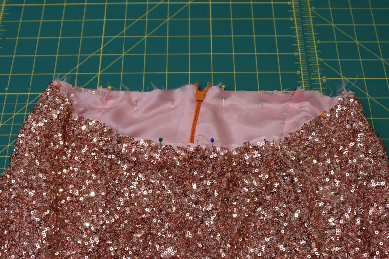 How To Pin Pants Waistlines Together - Baby Sequin Mesh - Mood Fabrics - Morganite Waistcoat Ensemble Free Sewing Pattern Tutorial - MDF519 - Mood Fabrics Sewciety Blog - Pin the pants waistlines together.