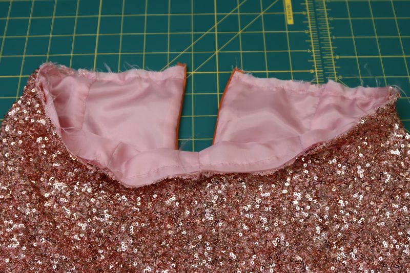 How To Sew Pants Waistlines Together With Quarter Inch Seam Allowance - Baby Sequin Mesh - Mood Fabrics - Morganite Waistcoat Ensemble Free Sewing Pattern Tutorial - MDF519 - Mood Fabrics Sewciety Blog - Sew the pants waistlines together with ¼ inch seam allowance.