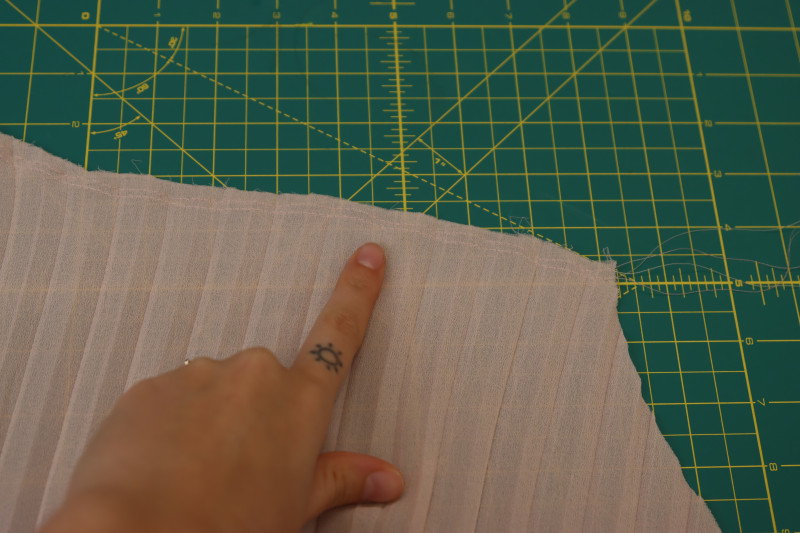 How To Sew Two Parallel Straight Stitches Along Waistline Of Skirt - Gutermann Sew All Thread - Mood Fabrics - Pyrite Pleated Dress Free Sewing Pattern Tutorial - MDF527 - Mood Fabrics Sewciety Blog - Sew two parallel straight stitches along the waistline of the skirt.