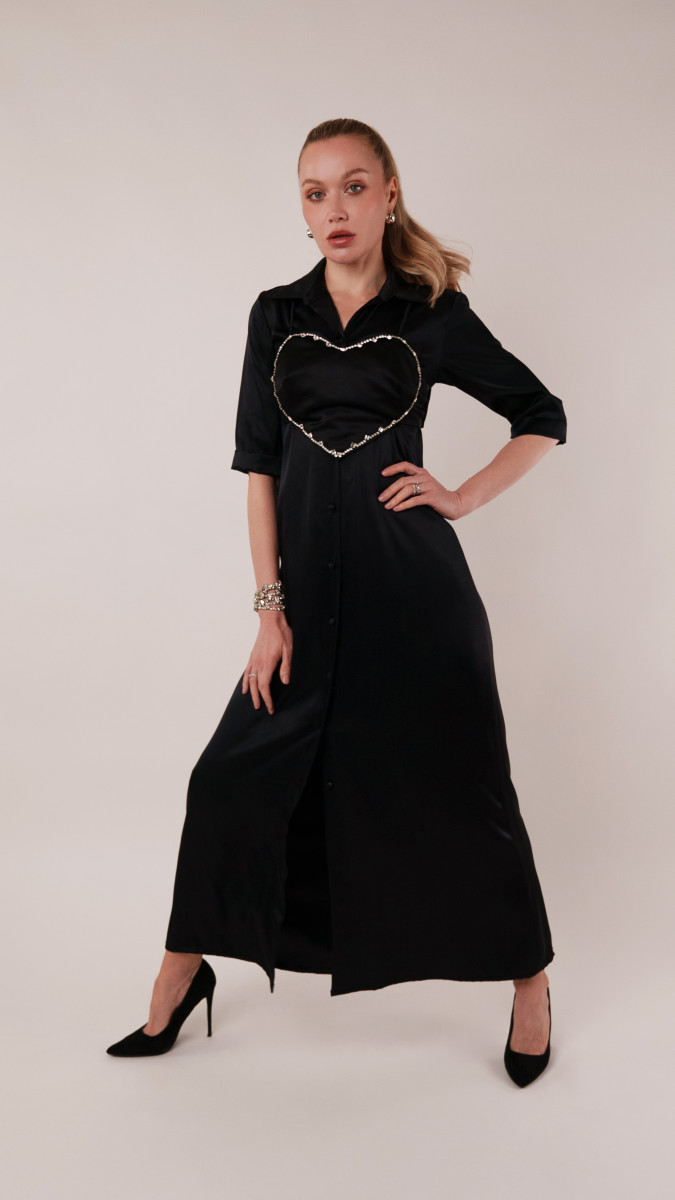 Model wearing The Apricot Ensemble Sewing Pattern posing for Corset Sewing Project Ideas. Free Sewing Pattern PDF from Mood Fabrics Sewciety Blog.