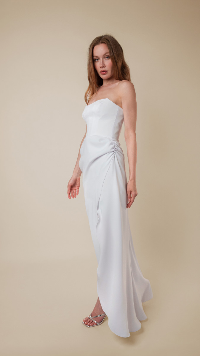 Model wearing The London Gown Sewing Pattern posing for Corset Sewing Project Ideas. Free Sewing Pattern PDF from Mood Fabrics Sewciety Blog.