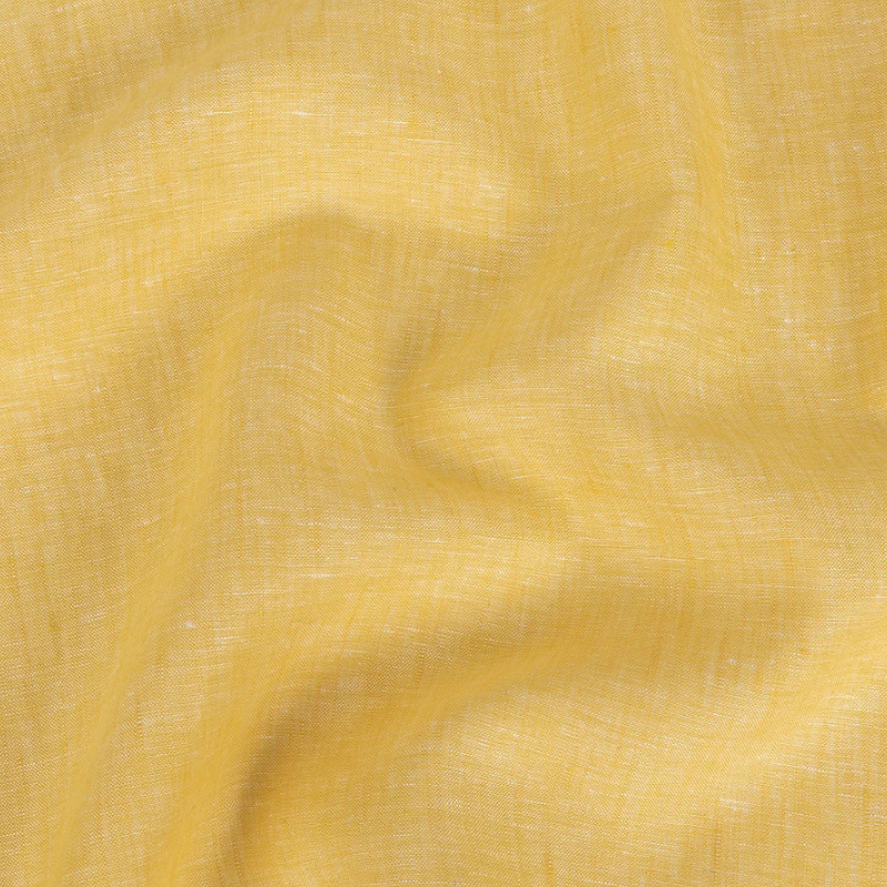 Lightweight Linen Chambray - Heathered Goldfinch - Minerva Collection fabric perfect for Free Transitional Spring Sewing Projects such as the Nettle Wrap Dress Redux Sewing Pattern free PDF download from Mood Fabrics Sewciety Blog.