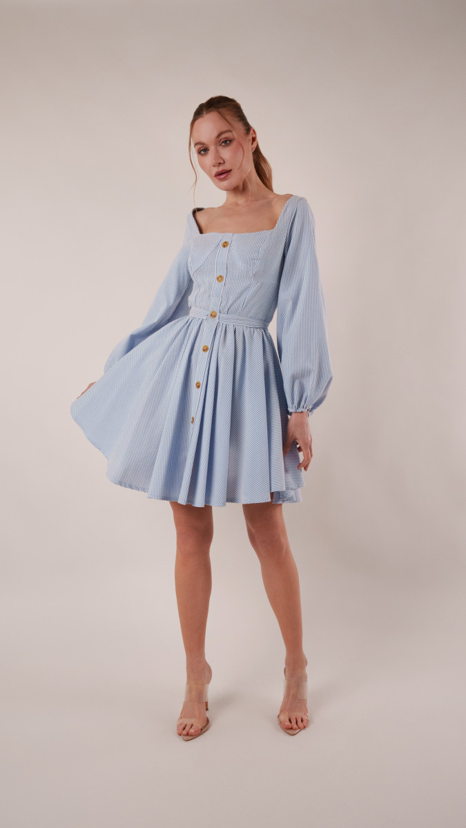 Model wearing Bellium-Bluebell Blend Sewing Pattern posing for Transitional Spring Sewing Project Ideas. Free Sewing Pattern PDF from Mood Fabrics Sewciety Blog.