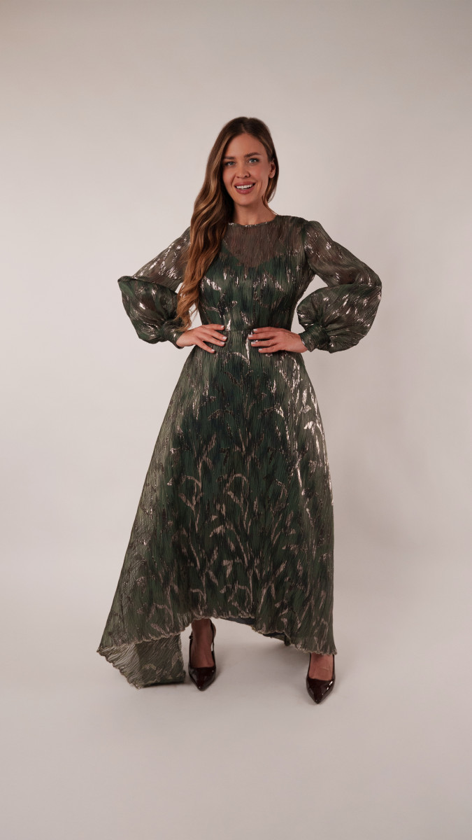 Model wearing Harper Plisse Dress Sewing Pattern posing for Transitional Spring Sewing Project Ideas. Free Sewing Pattern PDF from Mood Fabrics Sewciety Blog.