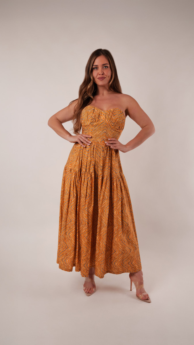 Model wearing Tamarind Dress Sewing Pattern posing for Transitional Spring Sewing Project Ideas. Free Sewing Pattern PDF from Mood Fabrics Sewciety Blog.