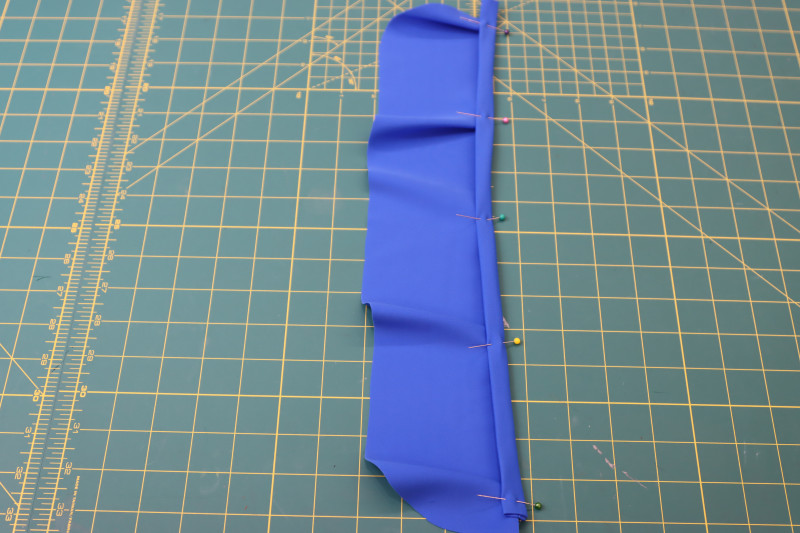 How To Pin Ruffle To Strap - Recycled Swimwear Tricot - Mood Fabrics - Azure Tankini Skirt Set Free Sewing Pattern Tutorial - MDF533 - Mood Fabrics Sewciety Blog - Evenly pin the ruffle to the strap.