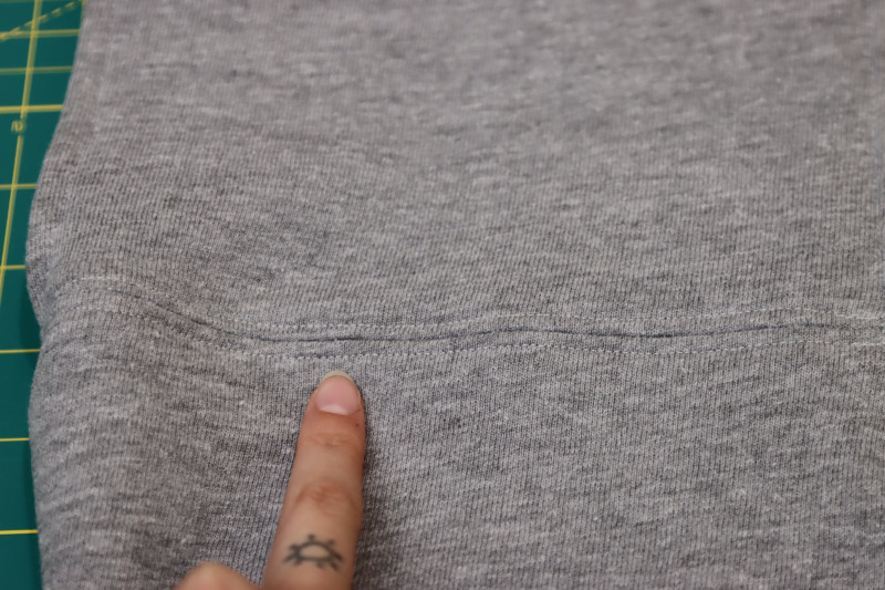 How To Topstitch Above And Below Front Bust Seam - Gutermann Sew All Thread - Mood Fabrics - Reef Sleeveless Cover Up Free Sewing Pattern Tutorial - MDF535 - Mood Fabrics Sewciety Blog - Topstitch above and below the front bust seam.