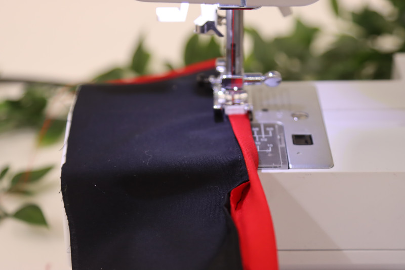 How To Fold Bias Binding Collar Edge - Red Quilting Cotton - Mood Fabrics - Matrix Shawl Collar Ensemble Free Sewing Pattern Tutorial - MDF543 - Mood Fabrics Sewciety Blog - Roll the bias binding around the edge of the collar.