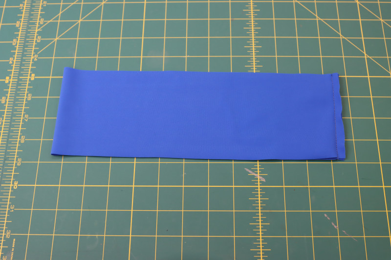 How To Sew Waistband Right Sides Together Along Short Ends - Recycled Swimwear Tricot - Mood Fabrics - Azure Tankini Skirt Set Free Sewing Pattern Tutorial - MDF533 - Mood Fabrics Sewciety Blog - Sew the waistband right sides together along the short ends.
