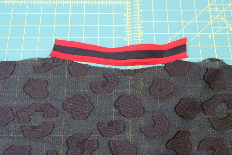 How To Cut Back Neckline Trim - Red Quilting Cotton - Mood Fabrics - Matrix Shawl Collar Ensemble Free Sewing Pattern Tutorial - MDF543 - Mood Fabrics Sewciety Blog - Cut one strip of trim for the back neckline.