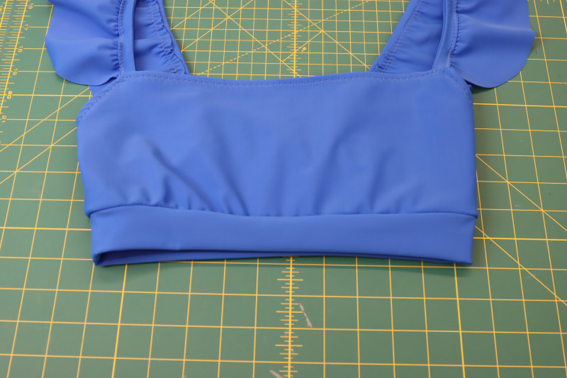 How To Sew Waistband To Bottom Of Bikini Top - Recycled Swimwear Tricot - Mood Fabrics - Azure Tankini Skirt Set Free Sewing Pattern Tutorial - MDF533 - Mood Fabrics Sewciety Blog - Sew the waistband to the bottom of the bikini top.