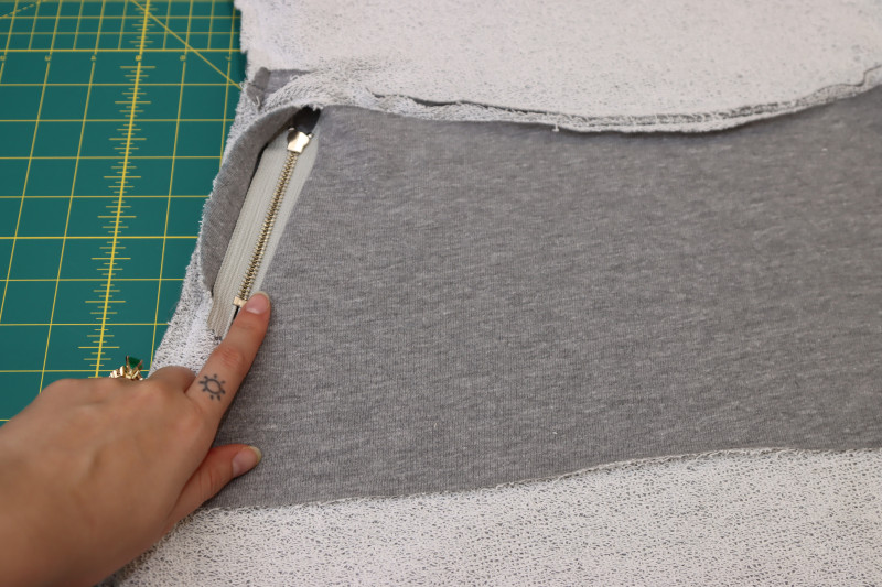 How To Sew Pocket Bag To Other Zipper Opening - Heather Gray French Terry - Mood Fabrics - Reef Sleeveless Cover Up Free Sewing Pattern Tutorial - MDF535 - Mood Fabrics Sewciety Blog - Sew the pocket bag right sides together with the other zipper.