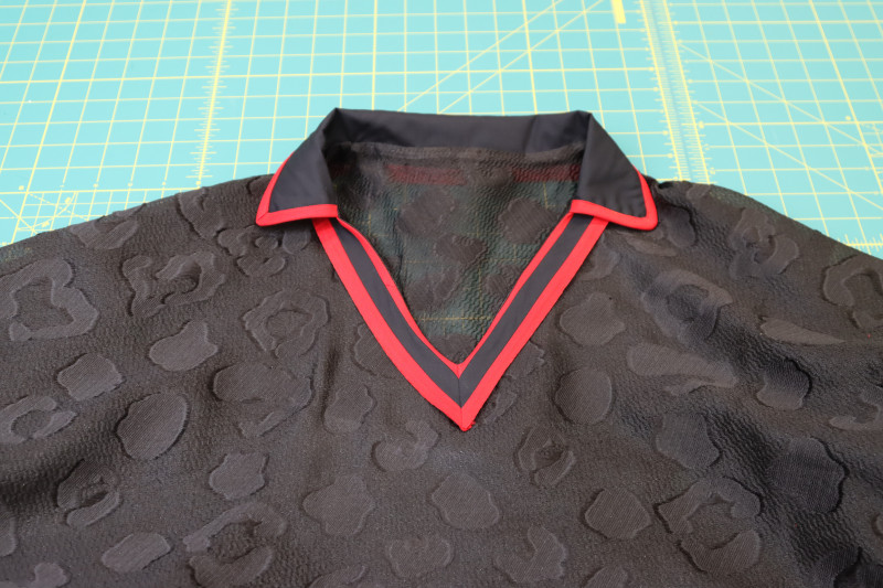 How To Flip Neckline Trim Right Side Shirt - Textured Burnout Brocade - Mood Fabrics - Matrix Shawl Collar Ensemble Free Sewing Pattern Tutorial - MDF543 - Mood Fabrics Sewciety Blog - Flip the neckline trim to the right side of the shirt.
