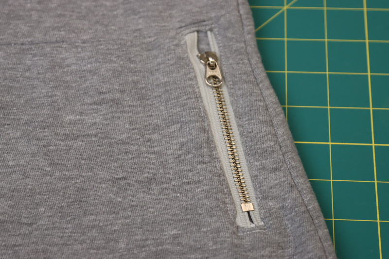 How To Topstitch Around Zipper Pockets - Gutermann Sew All Thread - Mood Fabrics - Reef Sleeveless Cover Up Free Sewing Pattern Tutorial - MDF535 - Mood Fabrics Sewciety Blog - Topstitch around the zipper pockets.