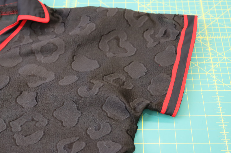 How To Sew Sleeve Hems - Gutermann Sew All Thread - Mood Fabrics - Matrix Shawl Collar Ensemble Free Sewing Pattern Tutorial - MDF543 - Mood Fabrics Sewciety Blog - Sew the trim to the sleeve hems.