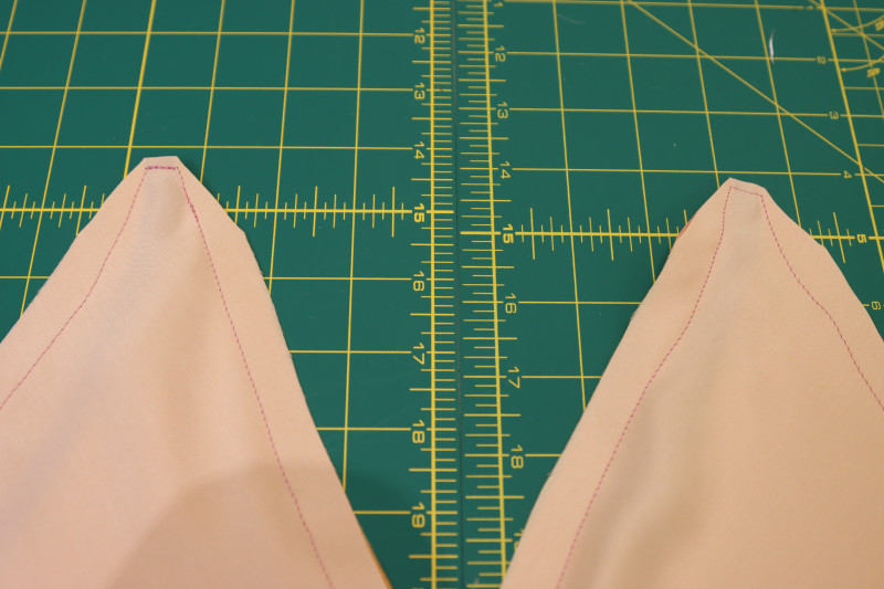 How To Clip Top Corners Bra Cups - Silk Charmeuse Print - Mood Fabrics - Alexandrite Sunset Silk Charmeuse Dress Free Sewing Pattern Tutorial - MDF529 - Mood Fabrics Sewciety Blog - Clip the top corners of the bra cups.