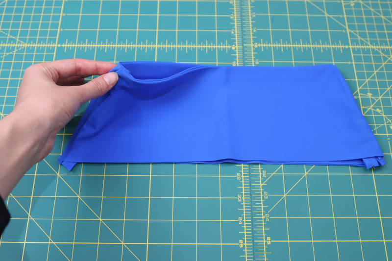 How To Flip Waistband Right Sides Out - Recycled Swimwear Tricot - Mood Fabrics - Azure Tankini Skirt Set Free Sewing Pattern Tutorial - MDF533 - Mood Fabrics Sewciety Blog - Flip the waistband right sides out.