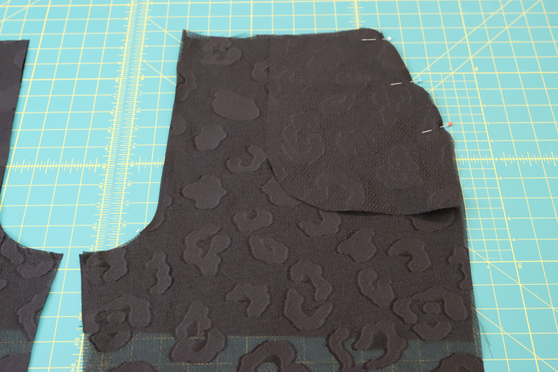 How To Pin Sew Pocket A Front Pants Side Seams - Black Quilting Cotton - Mood Fabrics - Matrix Shawl Collar Ensemble Free Sewing Pattern Tutorial - MDF543 - Mood Fabrics Sewciety Blog - Pin and sew pocket A to the front pants side seams right sides together.