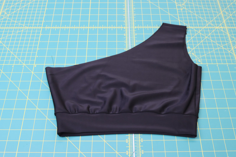 How To Sew Top Waistband To Bottom Of Bikini Top - Recycled Swimwear Tricot - Mood Fabrics - Antikythera One Shoulder Bikini Free Sewing Pattern Tutorial - MDF531 - Mood Fabrics Sewciety Blog - Sew the top waistband to the bottom of the bikini top.