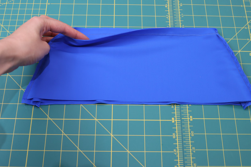 How To Sew Waistline Of Waistband - Recycled Swimwear Tricot - Mood Fabrics - Azure Tankini Skirt Set Free Sewing Pattern Tutorial - MDF533 - Mood Fabrics Sewciety Blog - Sew the waistline of the waistband.