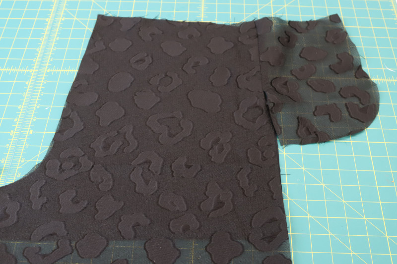 How To Press Back Pocket Seam - Textured Burnout Brocade - Mood Fabrics - Matrix Shawl Collar Ensemble Free Sewing Pattern Tutorial - MDF543 - Mood Fabrics Sewciety Blog - Press the back pocket seams open and flat.