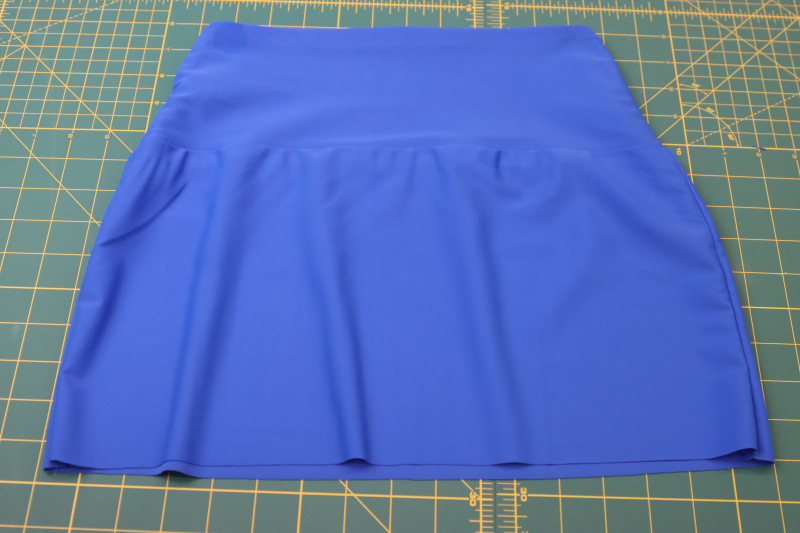 How To Sew Waistband To Skirt Waistline - Recycled Swimwear Tricot - Mood Fabrics - Azure Tankini Skirt Set Free Sewing Pattern Tutorial - MDF533 - Mood Fabrics Sewciety Blog - Sew the waistband to the skirt waistline.