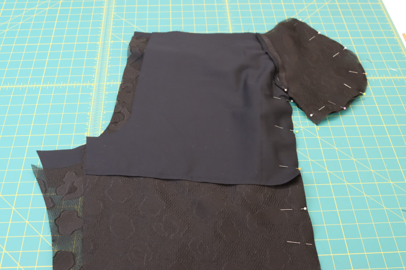 How To Pin Front Back Pants Side Seams Pocket Bag - Textured Burnout Brocade - Mood Fabrics - Matrix Shawl Collar Ensemble Free Sewing Pattern Tutorial - MDF543 - Mood Fabrics Sewciety Blog - Pin the front and back pants pieces together at the side seams and around the pocket bag.