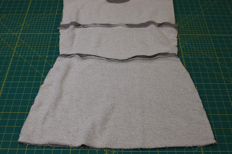 How To Pin Sew Side Seams Of Dress - Heather Gray French Terry - Mood Fabrics - Reef Sleeveless Cover Up Free Sewing Pattern Tutorial - MDF535 - Mood Fabrics Sewciety Blog - Pin and sew the side seams of the dress.
