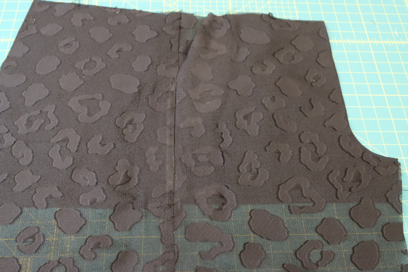 How To Press Side Seams Pockets - Textured Burnout Brocade - Mood Fabrics - Matrix Shawl Collar Ensemble Free Sewing Pattern Tutorial - MDF543 - Mood Fabrics Sewciety Blog - Press the side seams open and flat and the pockets toward the front of the pants.