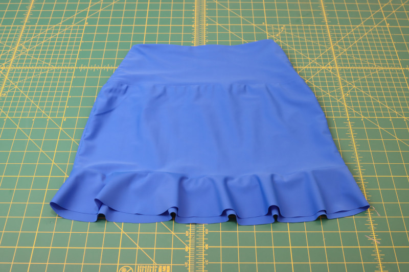 How To Sew Ruffle To Hem Of Skirt - Recycled Swimwear Tricot - Mood Fabrics - Azure Tankini Skirt Set Free Sewing Pattern Tutorial - MDF533 - Mood Fabrics Sewciety Blog - Sew the ruffle to the hem of the skirt.