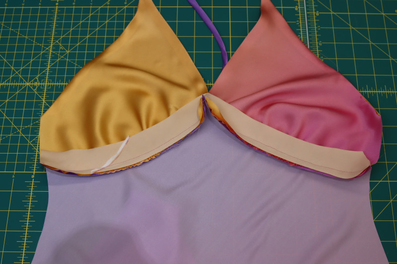 How To Sew Bias Tape Right Sides Together Bust Seam Allowance - Silk Charmeuse Print - Mood Fabrics - Alexandrite Sunset Silk Charmeuse Dress Free Sewing Pattern Tutorial - MDF529 - Mood Fabrics Sewciety Blog - Sew the bias tape right sides together with the bust seam allowance.
