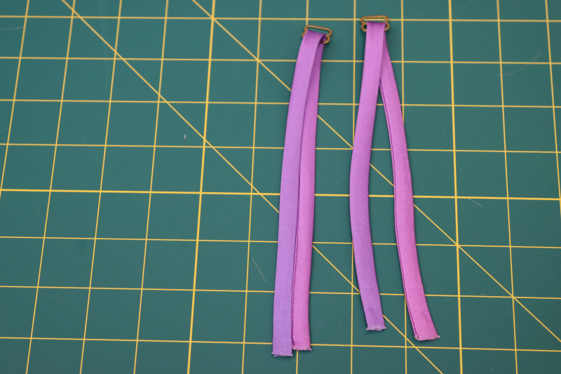 How To Insert Back Straps Bottom Loop Strap Adjusters - Gold Metal Strap Sliders - Mood Fabrics - Alexandrite Sunset Silk Charmeuse Dress Free Sewing Pattern Tutorial - MDF529 - Mood Fabrics Sewciety Blog - Insert the back straps into the bottom loop of the strap adjusters.
