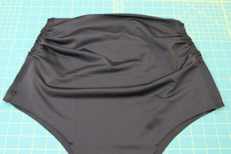 How To Pin Sew Bikini Bottom Side Seams Right Sides Together - Recycled Swimwear Tricot - Mood Fabrics - Antikythera One Shoulder Bikini Free Sewing Pattern Tutorial - MDF531 - Mood Fabrics Sewciety Blog - Pin and sew the bikini bottom side seams right sides together.