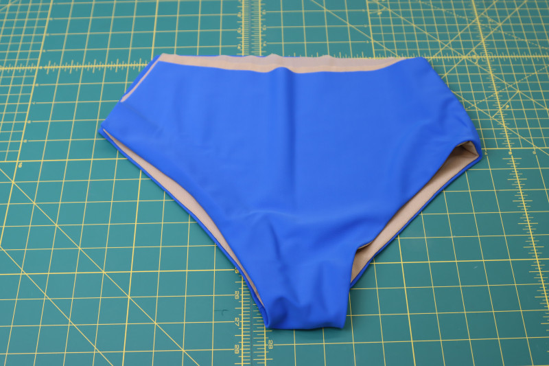 How To Press Both Leg Holes - Recycled Swimwear Tricot - Mood Fabrics - Azure Tankini Skirt Set Free Sewing Pattern Tutorial - MDF533 - Mood Fabrics Sewciety Blog - Press both leg holes.