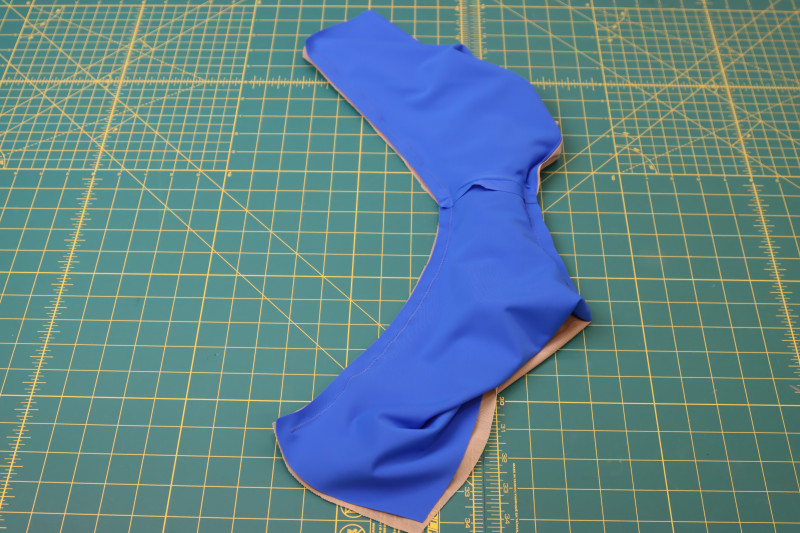 How To Sew Other Leg Hole Right Sides Together - Recycled Swimwear Tricot - Mood Fabrics - Azure Tankini Skirt Set Free Sewing Pattern Tutorial - MDF533 - Mood Fabrics Sewciety Blog - Use the burrito method to sew the other leg hole right sides together.