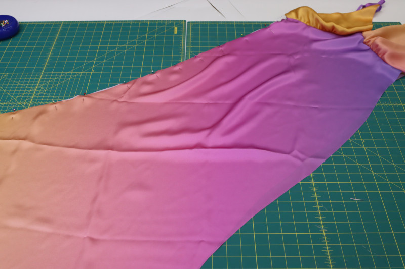 How To Pin Dress Wrong Sides Together Side Seams - Silk Charmeuse Print - Mood Fabrics - Alexandrite Sunset Silk Charmeuse Dress Free Sewing Pattern Tutorial - MDF529 - Mood Fabrics Sewciety Blog - Pin the dress wrong sides together at the side seams.