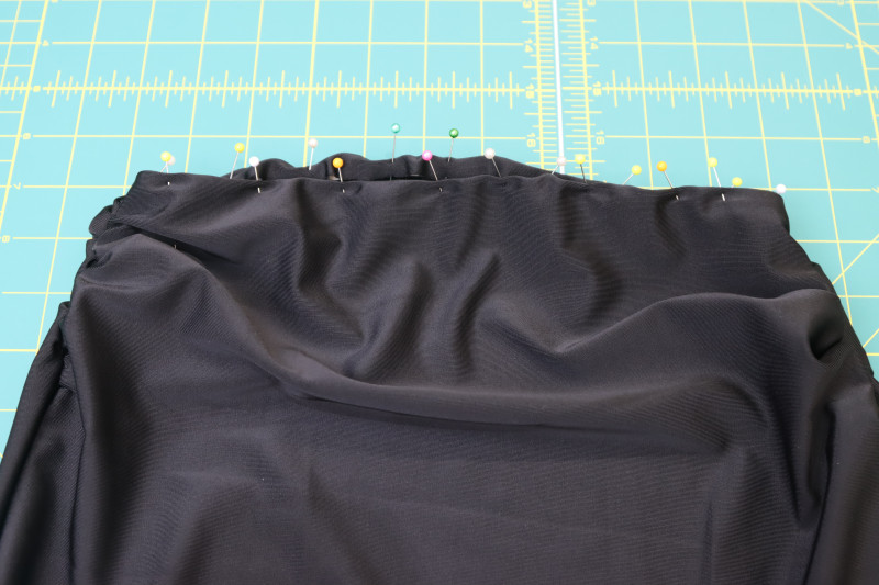 How To Pin Elastic Around Bikini Bottom Openings - Cotton Swimwear Elastic - Mood Fabrics - Antikythera One Shoulder Bikini Free Sewing Pattern Tutorial - MDF531 - Mood Fabrics Sewciety Blog - Pin the elastic around the bikini bottom openings.