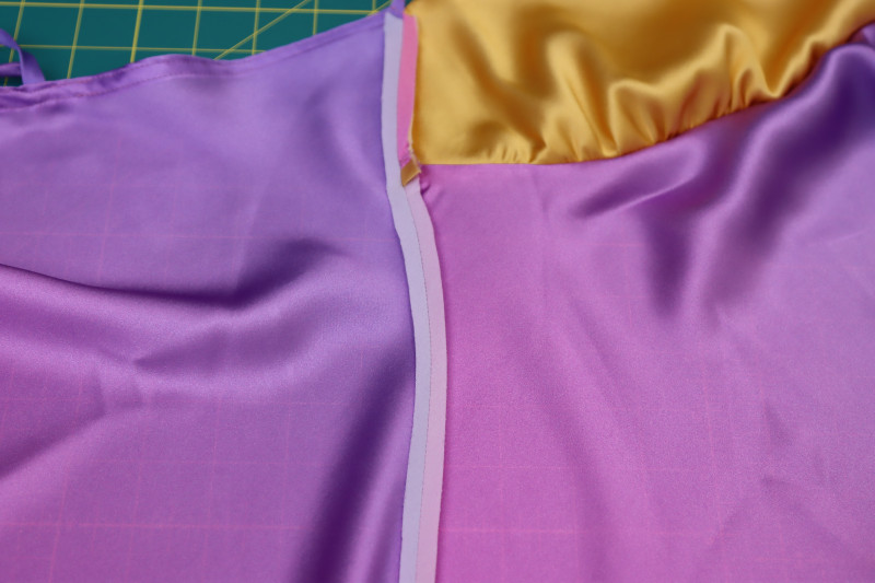 How To Press Side Seams Open Flat - Silk Charmeuse Print - Mood Fabrics - Alexandrite Sunset Silk Charmeuse Dress Free Sewing Pattern Tutorial - MDF529 - Mood Fabrics Sewciety Blog - Press the side seams open and flat.