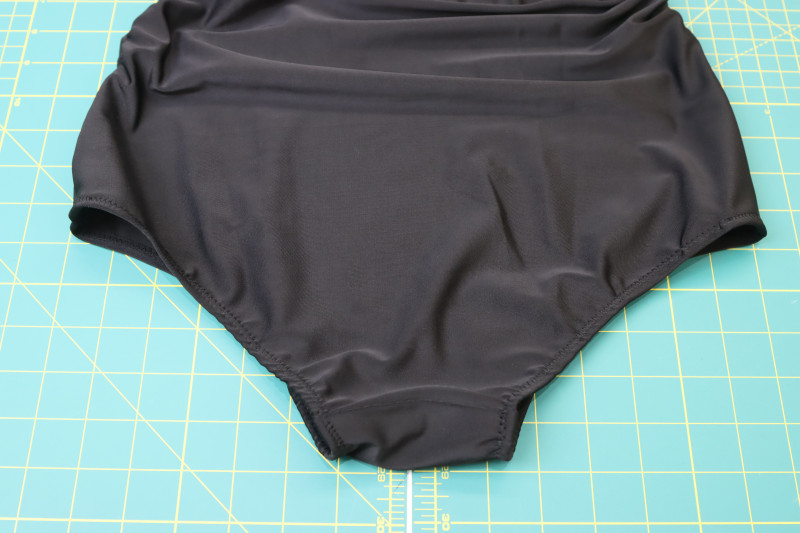 How To Topstitch Leg Opening Elastic With Zigzag Stitch - Cotton Swimwear Elastic - Mood Fabrics - Antikythera One Shoulder Bikini Free Sewing Pattern Tutorial - MDF531 - Mood Fabrics Sewciety Blog - Topstitch over the leg opening elastic with a zigzag stitch.