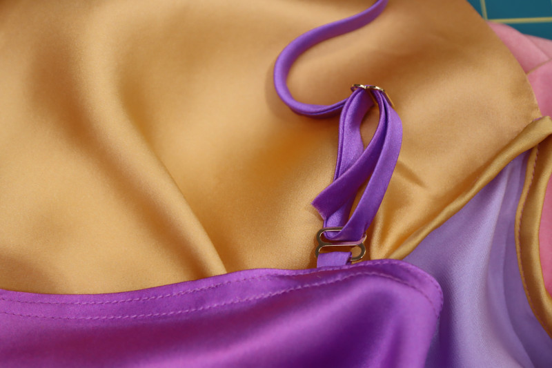 How To Insert Front Strap Back Through Top Strap Adjuster - Gold Metal Strap Sliders - Mood Fabrics - Alexandrite Sunset Silk Charmeuse Dress Free Sewing Pattern Tutorial - MDF529 - Mood Fabrics Sewciety Blog - Insert the front strap back through the top strap adjuster.