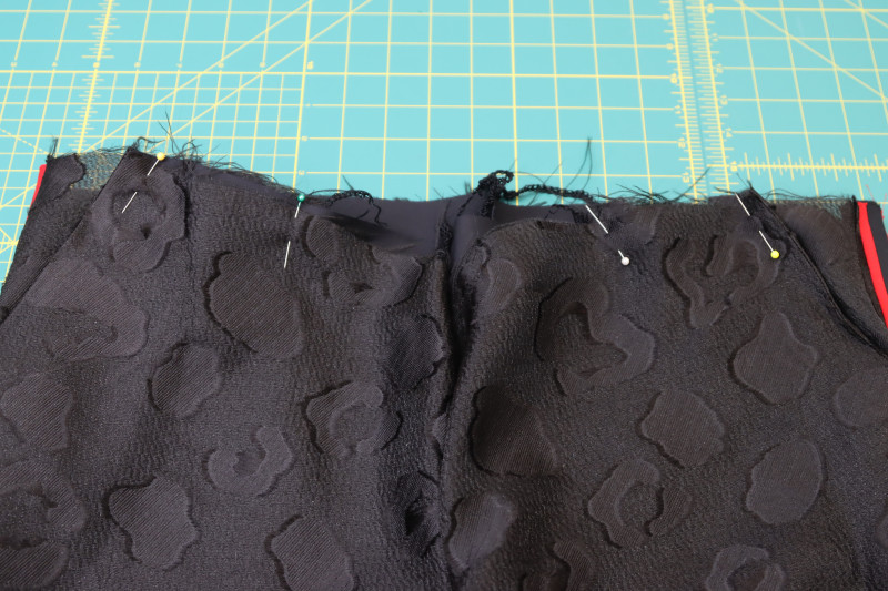 How To Pin Pocket Bags Front Waistline - Textured Burnout Brocade - Mood Fabrics - Matrix Shawl Collar Ensemble Free Sewing Pattern Tutorial - MDF543 - Mood Fabrics Sewciety Blog - Pin the tops of the pocket bags to the front waistline.