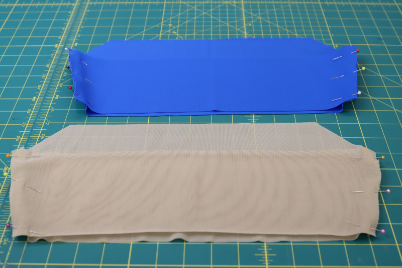 How To Pin Top Side Seams For Main Fabric And Lining - Recycled Swimwear Tricot - Mood Fabrics - Azure Tankini Skirt Set Free Sewing Pattern Tutorial - MDF533 - Mood Fabrics Sewciety Blog - Pin the top side seams for both the main fabric and the lining.