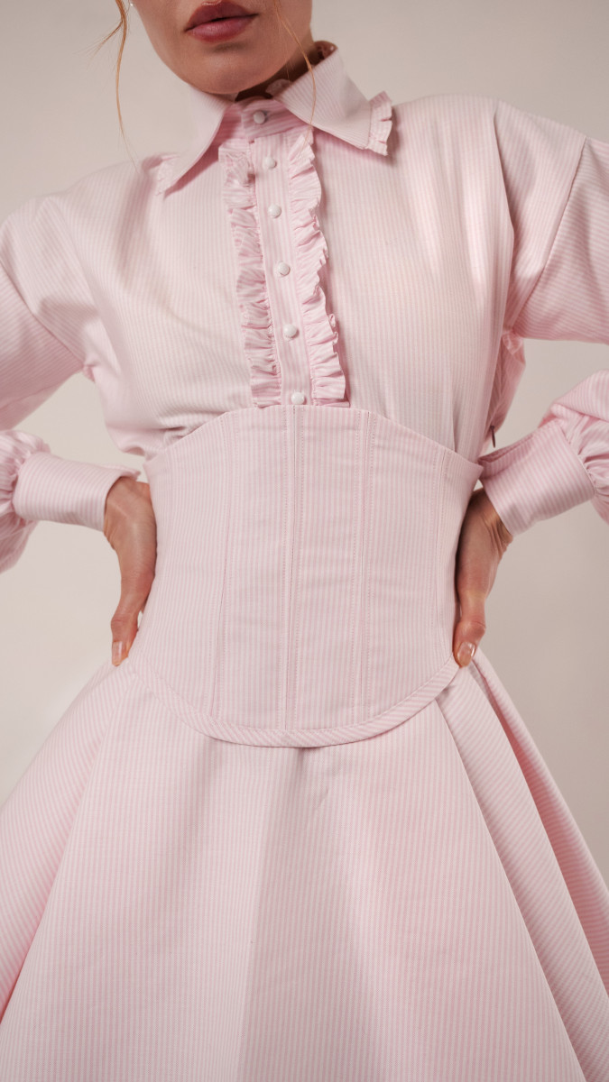 Close-up of the Keats Corset made in pink candy-striped cotton shirting, highlighting the precision boning and structured waist cincher.