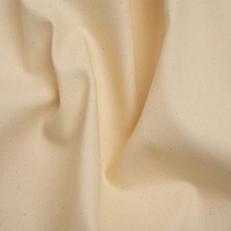Natural Ecru Organic Cotton Denim Twill by Rag & Bone a Designer Deadstock Made in Italy fabric perfect for Free Summer Vacation Capsule Wardrobe Sewing Projects such as the Biarritz Skort Sewing Pattern free PDF download from Mood Fabrics Sewciety Blog.