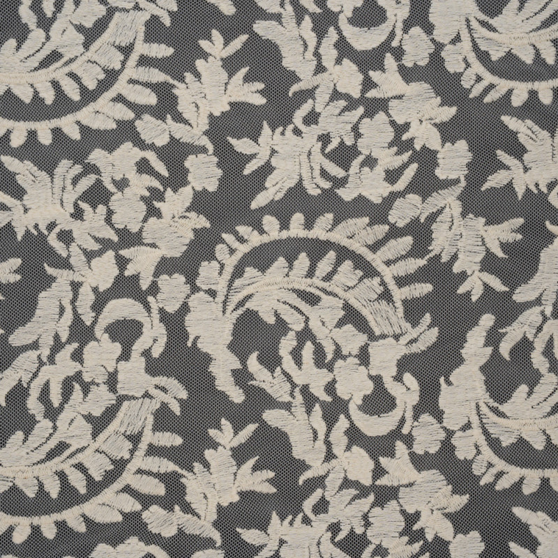 Ivory Floral Crescents Embroidered Lace Deadstock fabric perfect for Free Summer Vacation Capsule Wardrobe Sewing Projects such as the Taiga Trapeze Skirt Sewing Pattern free PDF download from Mood Fabrics Sewciety Blog.