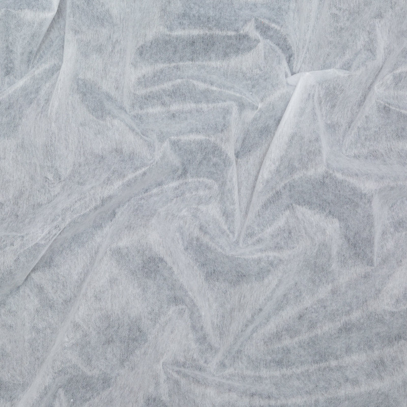 Super White Hot Rolling Nonwoven Fusible Interfacing fabric perfect for Free Summer Vacation Capsule Wardrobe Sewing Projects such as the Taiga Trapeze Skirt Sewing Pattern free PDF download from Mood Fabrics Sewciety Blog.