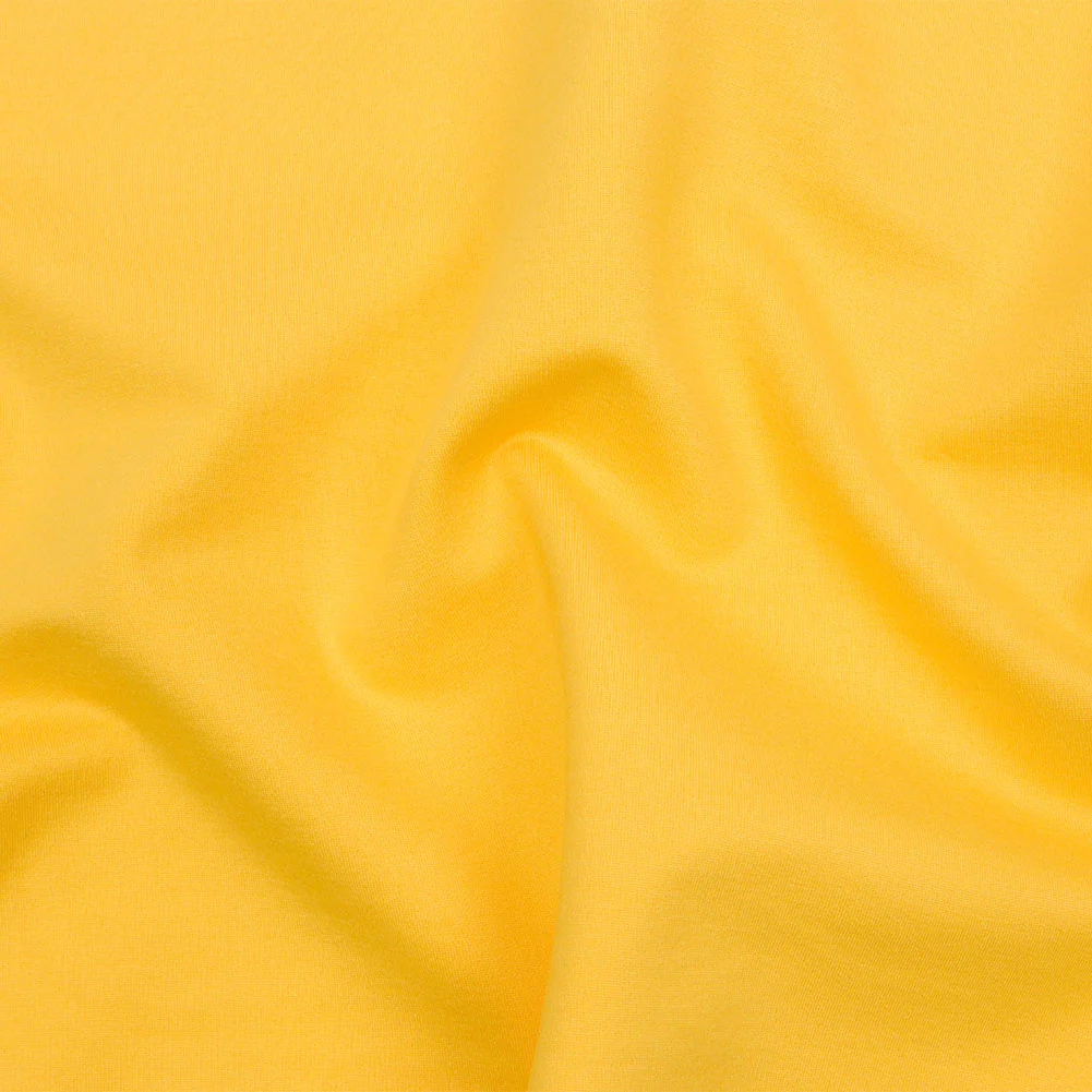 Stretch Ponte Knit - Sunshine Yellow - Papilio Collection fabric perfect for Free Summer Vacation Capsule Wardrobe Sewing Projects such as the Clara Bodysuit Sewing Pattern free PDF download from Mood Fabrics Sewciety Blog.