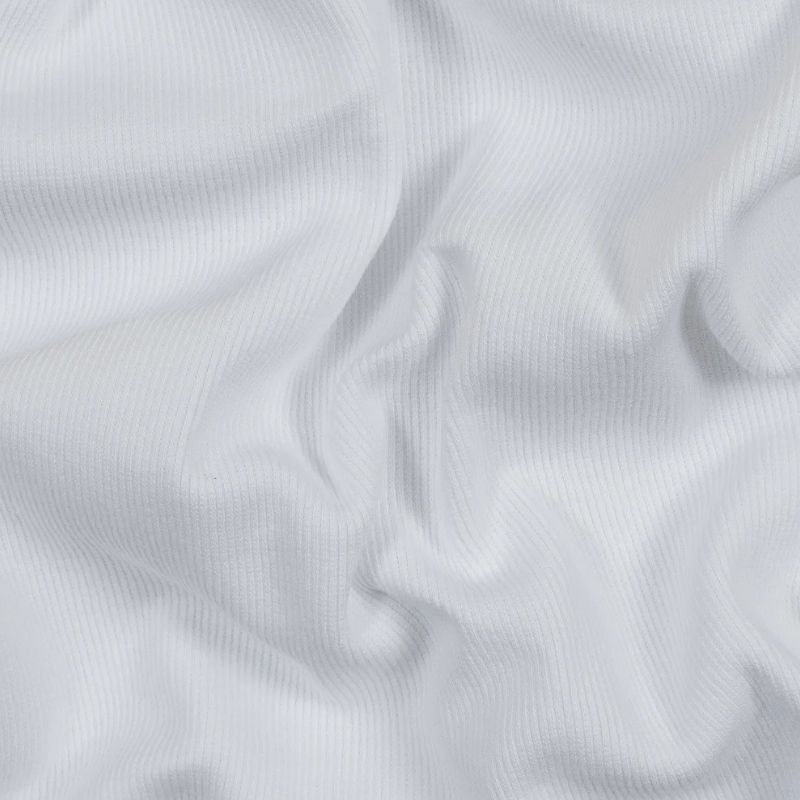 White Tubular Cotton Rib Knit fabric perfect for Free Summer Vacation Capsule Wardrobe Sewing Projects such as the Sylvan Tank Sewing Pattern free PDF download from Mood Fabrics Sewciety Blog.