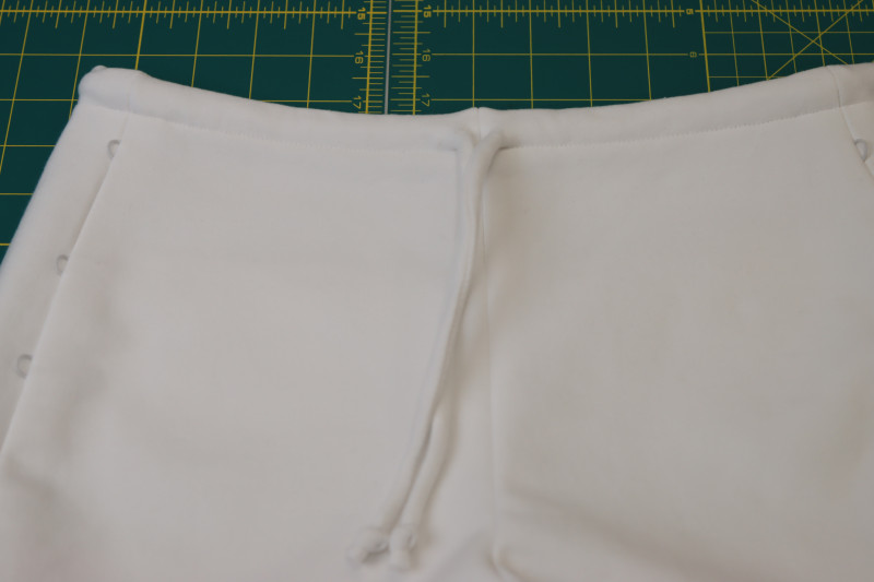 How To Insert Drawstring Waistband Tunnel - Fleece Backed Stretch Cotton Knit - Mood Fabrics - Fiona Athletic Set Free Sewing Pattern Tutorial - MDF537 - Mood Fabrics Sewciety Blog - Insert the drawstring into the waistband tunnel with a safety pin.