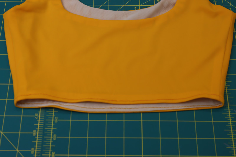 How To Topstitch Top Waistline - Gutermann Sew All Thread - Mood Fabrics - Amber Two Piece Cheeky Swimsuit Free Sewing Pattern Tutorial - MDF540 - Mood Fabrics Sewciety Blog - Topstitch around the waistline of the top.